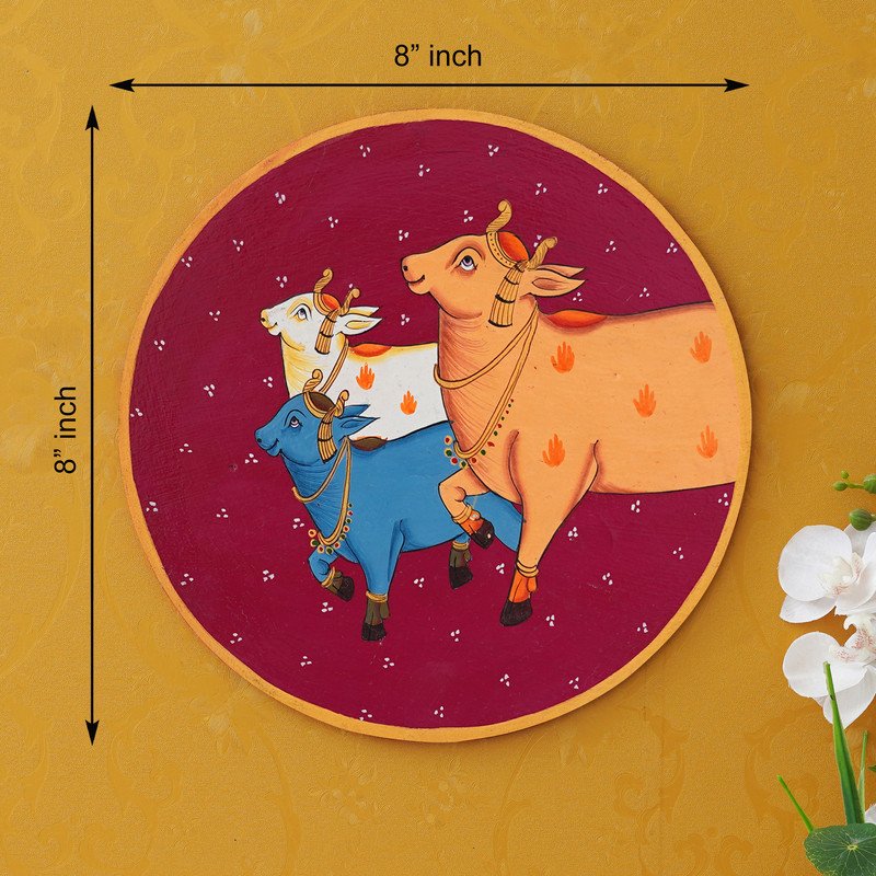 Crafted on a wooden plate, this pichwai portrays three cows in a circular formation.