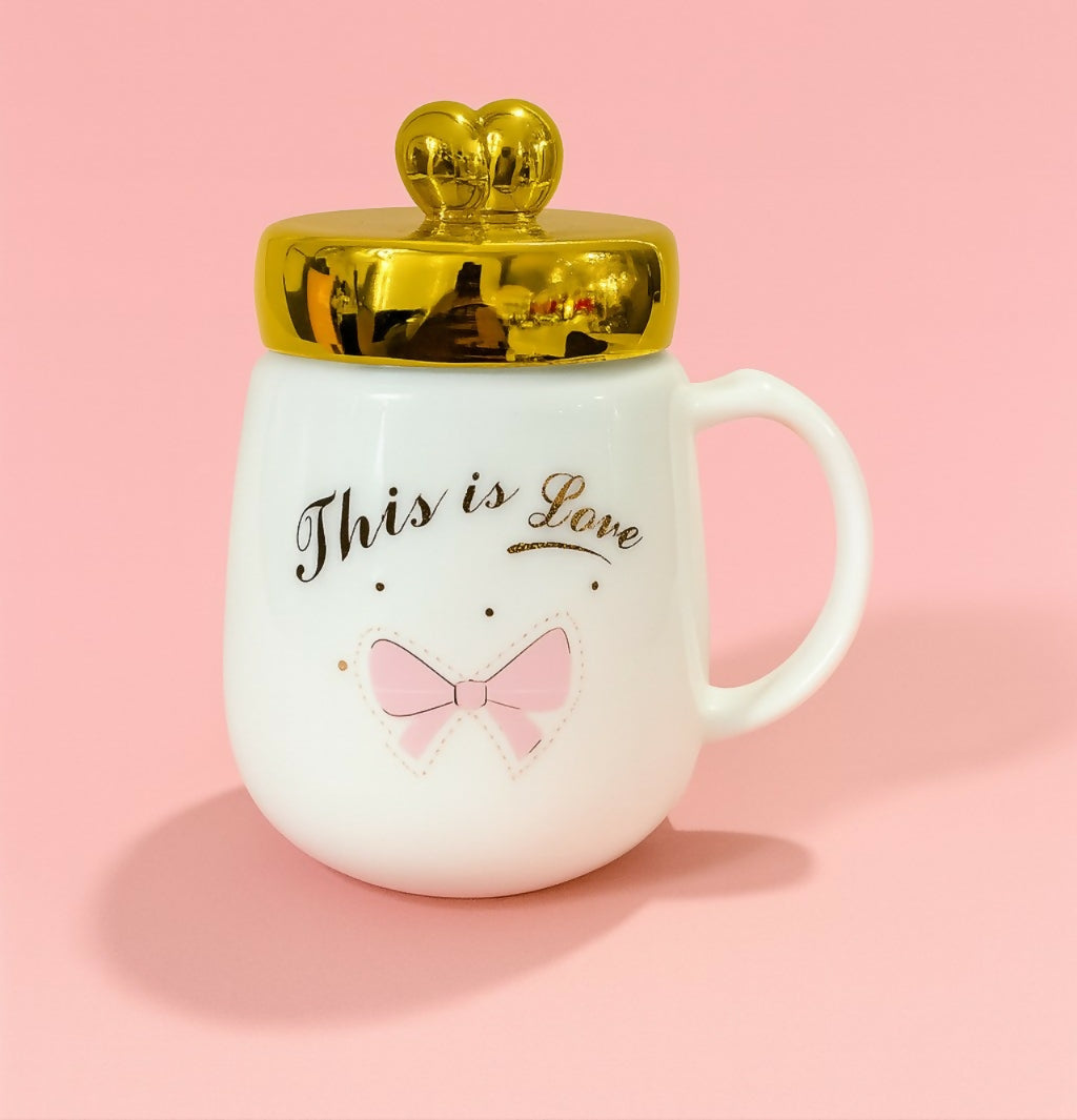 “This is Love” White Ceramic Mug with Golden Heart Lid and Pink Bow Print – Cute Romantic Gift Coffee Cup with Handle for Women, Girls & Couples – Premium Valentine & Anniversary Mug