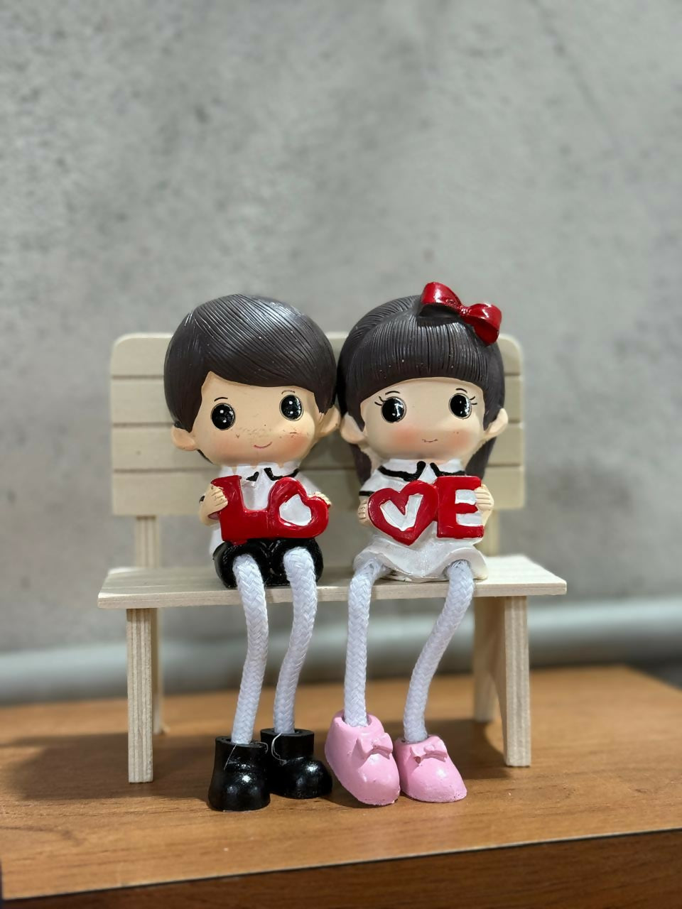 Cute Romantic Couple Figurine Sitting on Bench Holding “LOVE” Letters | Adorable Resin Doll Showpiece for Home Décor, Bedroom, Office Desk & Gifting | Valentine, Anniversary, Wedding & Birthday Gift