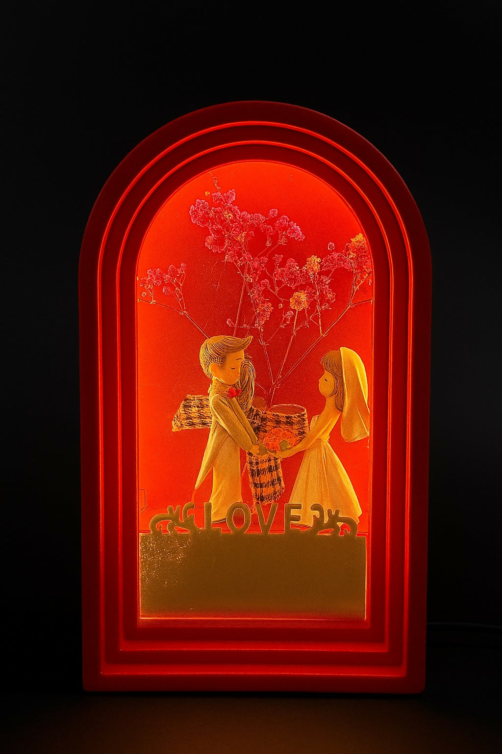 Romantic Wedding Couple Showpiece in Red Arch Frame – LOVE-Themed Decorative Gift for Anniversary, Valentine, Engagement & Home Decor – Bride and Groom Figurine with Floral Background