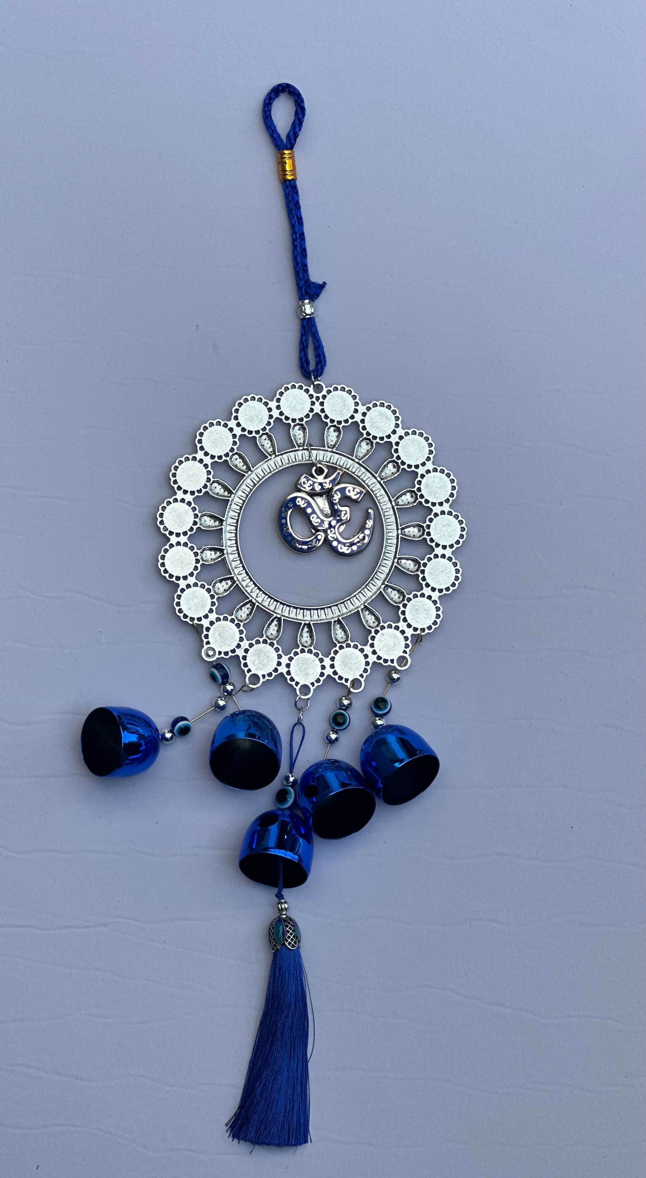 Evil Eye Wall Hanging with Om and Lord Ganesha Symbol – Decorative Blue Nazar Protection Talisman with Bells and Tassels – Vastu and Feng Shui Positive Energy Charm for Home, Office, Temple, or Car Décor