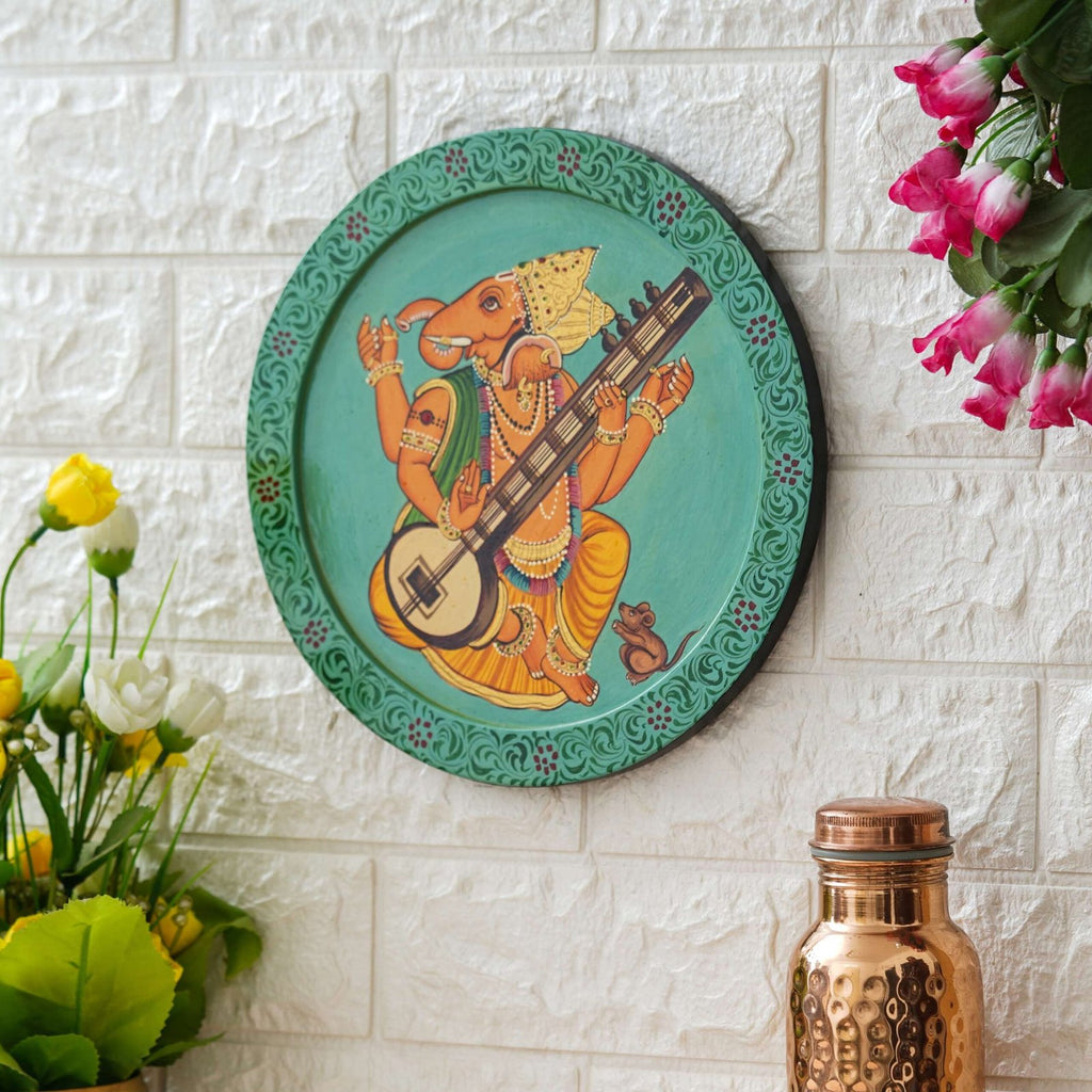 This beautiful pichwai painting features a majestic ganesh ji perched on a vibrant flowering branch.