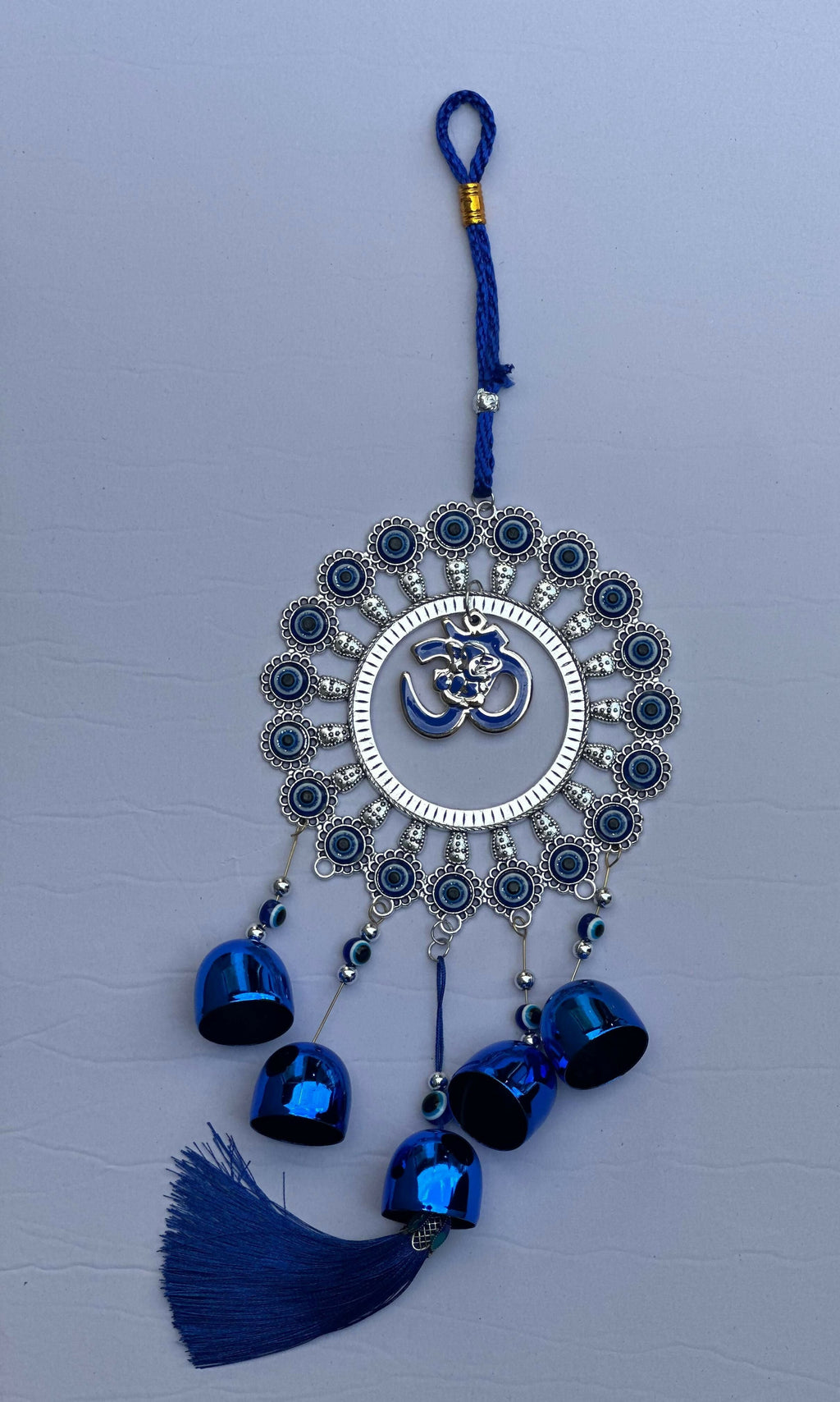 Evil Eye Wall Hanging with Om and Lord Ganesha Symbol – Decorative Blue Nazar Protection Talisman with Bells and Tassels – Vastu and Feng Shui Positive Energy Charm for Home, Office, Temple, or Car Décor
