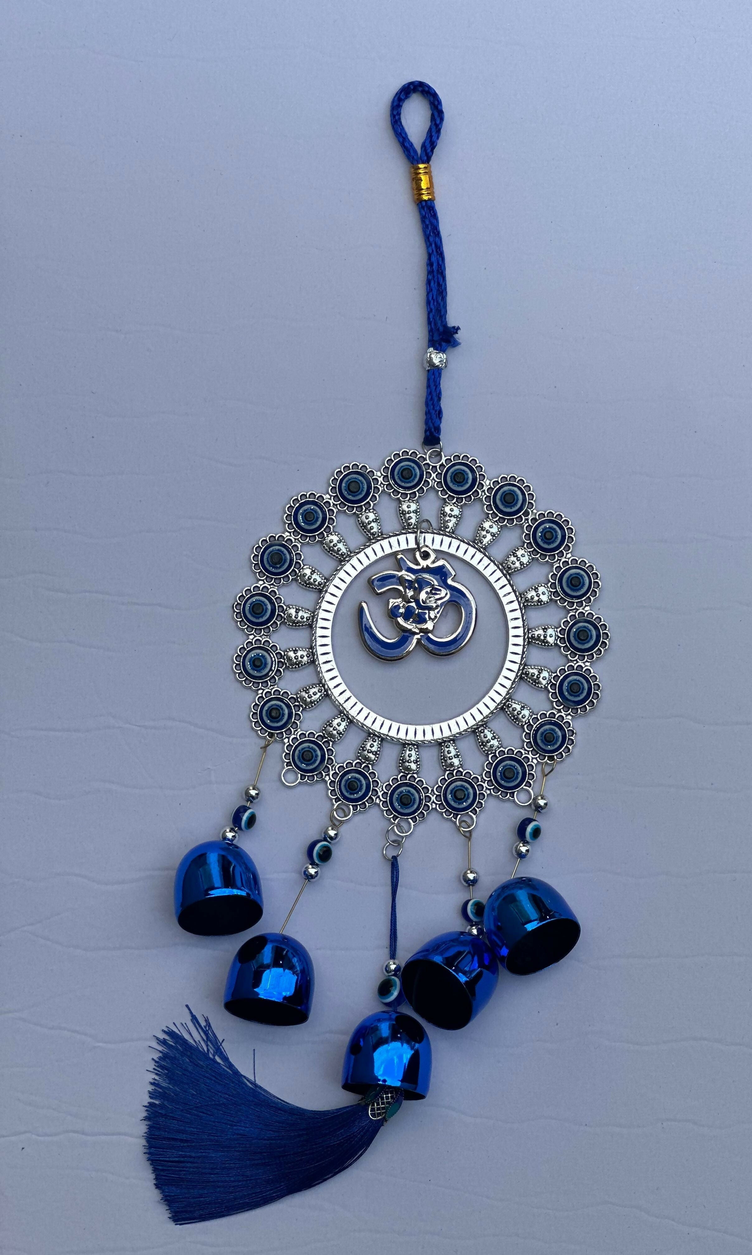 Evil Eye Wall Hanging with Om and Lord Ganesha Symbol – Decorative Blue Nazar Protection Talisman with Bells and Tassels – Vastu and Feng Shui Positive Energy Charm for Home, Office, Temple, or Car Décor