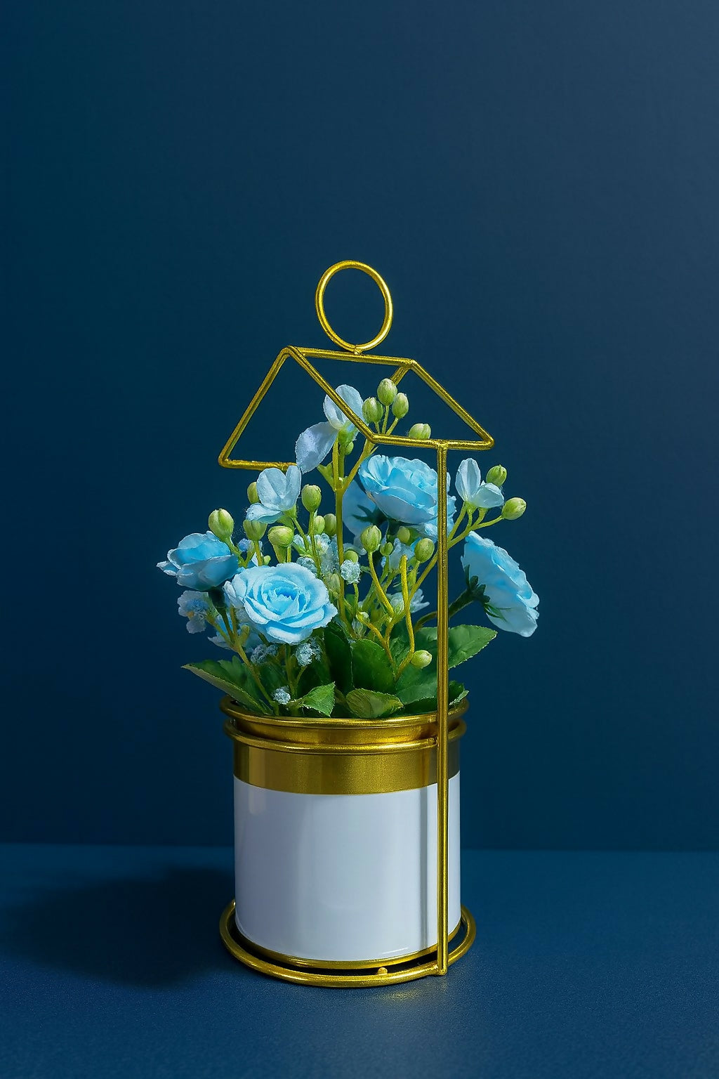 Golden Metal House-Shaped Stand with Artificial Blue Roses and Fillers in Glossy White Pot – Elegant Decorative Flower Arrangement for Home, Office & Gift