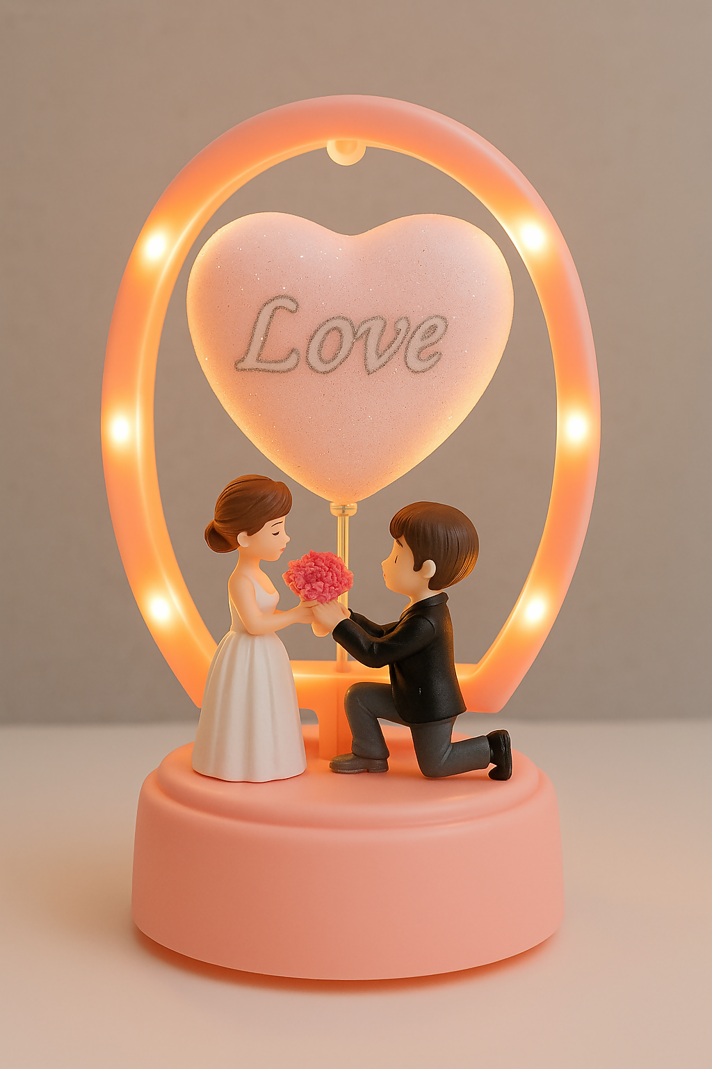 Romantic Couple Figurine Showpiece with LED Heart Balloon – Proposal Scene Love Lamp for Valentine’s Day, Wedding, Anniversary, Birthday & Home Table Decoration (Battery Operated – Pink Base)