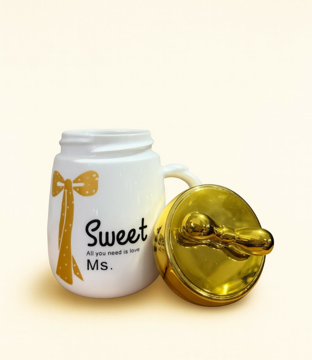 Sweet Ms. Ceramic Mug with Golden Bow Lid – White Coffee & Tea Cup with Yellow Ribbon Print – Cute Gift Mug for Girls, Women, Friends – “All You Need is Love” Printed Cup