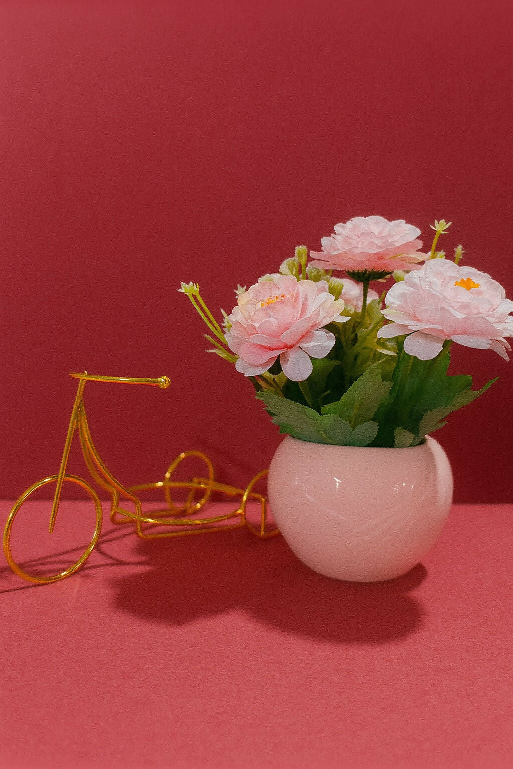 Artificial Pink Rose Flower Arrangement in Glossy Light Pink Ceramic Pot with Golden Bicycle Stand – Elegant Decorative Table Centerpiece for Home, Office, and Gifting