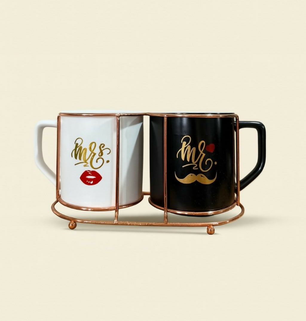 Mr and Mrs Ceramic Mug Set with Gold Print and Metal Holder – Black & White Coffee Cups for Couples – Stylish Tea Mugs with Mustache & Lip Design – Romantic Gift for Wedding, Anniversary, Valentine’s Day