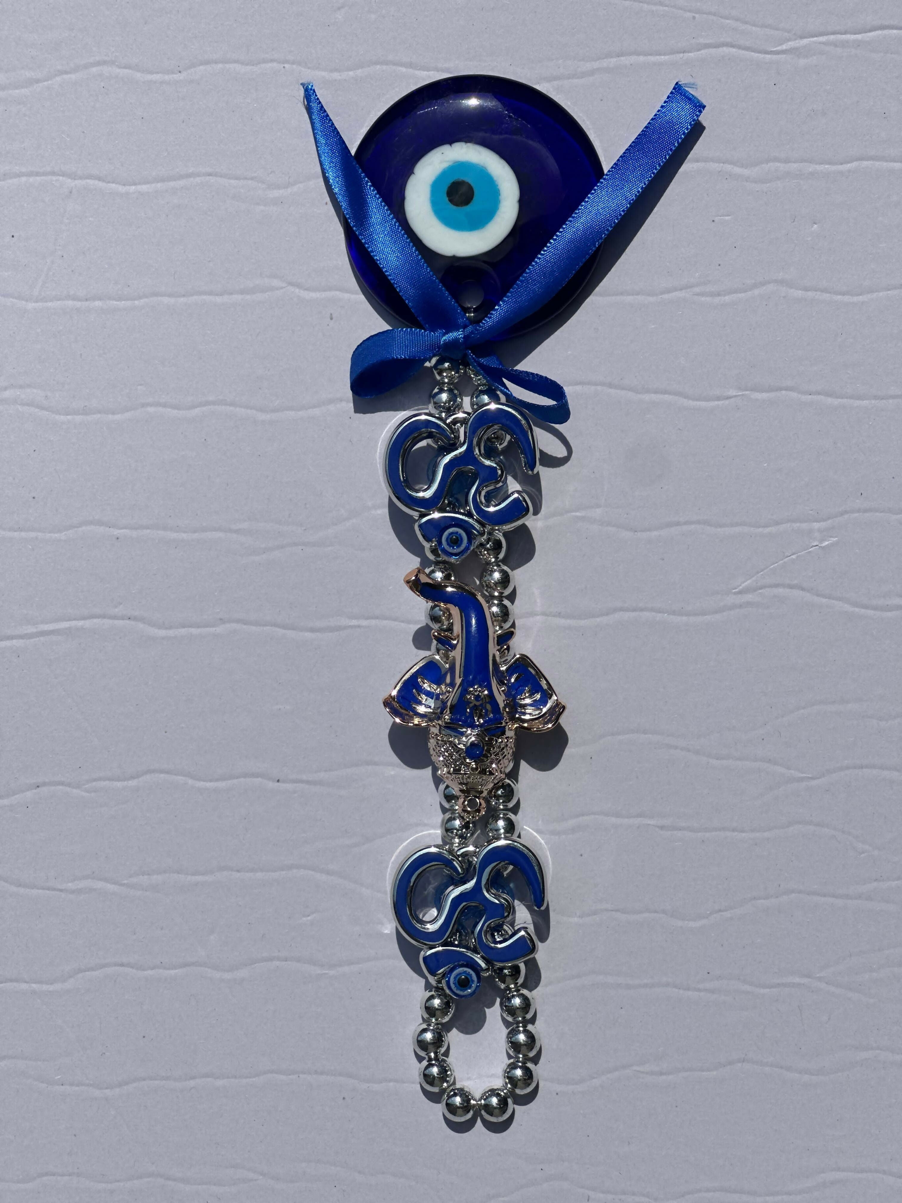Spiritual Evil Eye Wall Hanging with Om Symbol and Lord Ganesha Design – Blue Nazar Protection Talisman for Home, Office, or Car Decor – Traditional Hindu Good Luck Charm with Bow and Beaded Loop for Positive Vibes and Protection Against Negativity
