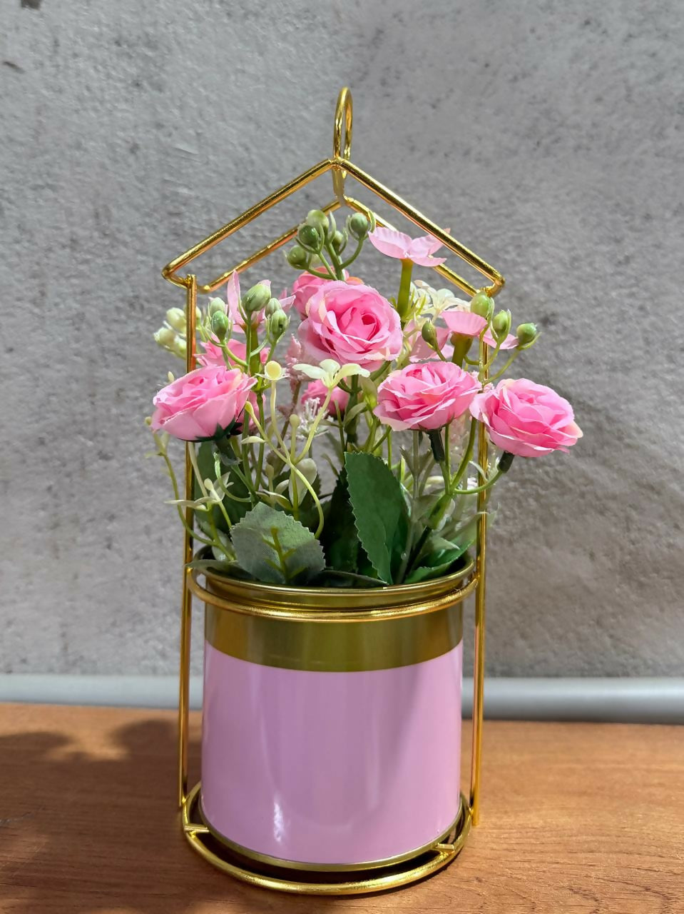 Golden Metal Frame House-Shaped Stand with Artificial Pink Roses in Glossy Pink Pot – Decorative Flower Arrangement for Home, Office, and Gift Use