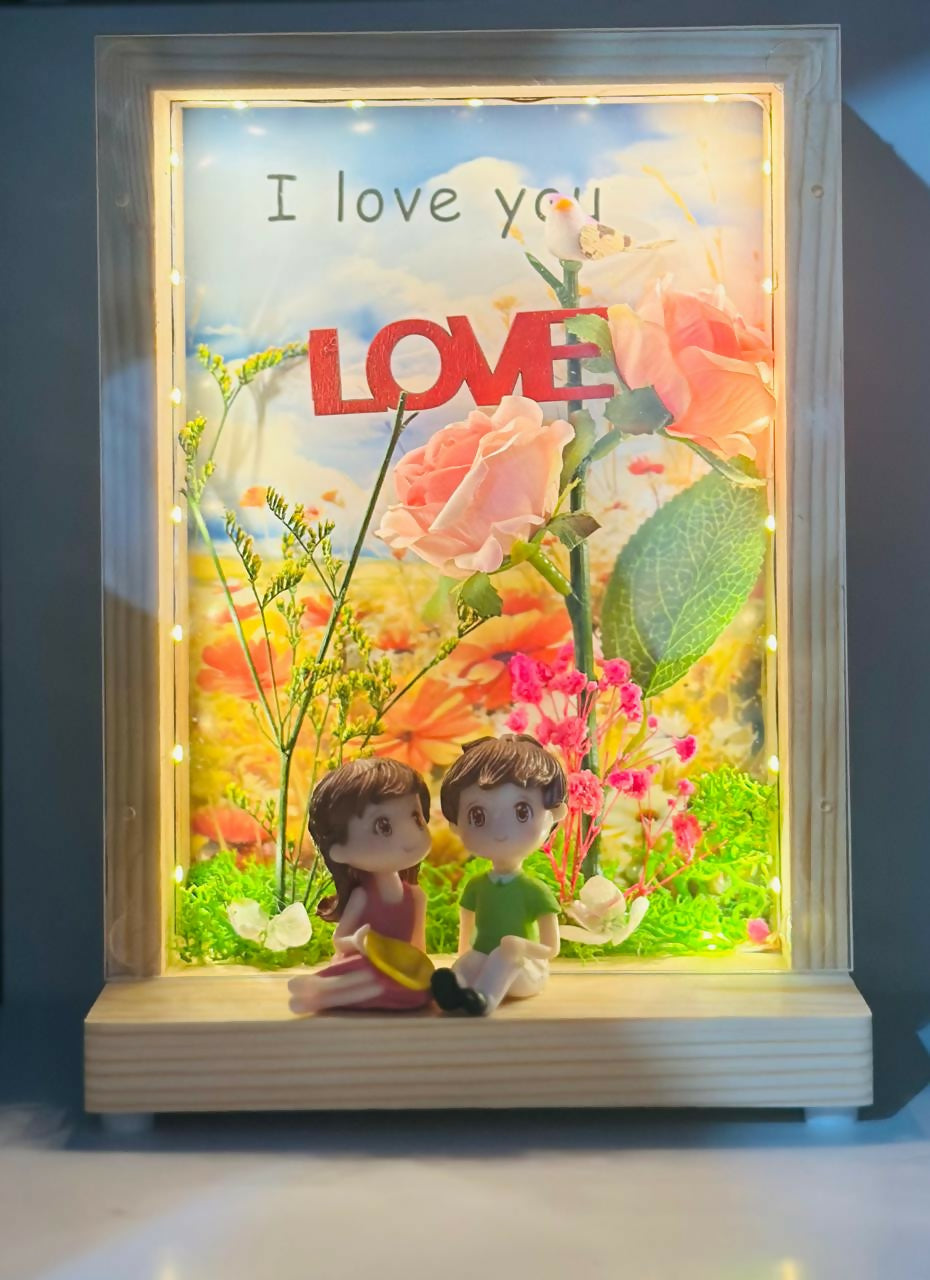 Love-Themed LED Wooden Display Case with Pink Rose Bouquet and Boy-Girl Figurines photo frame – Elegant Night Light and Sentimental Gift for Couples