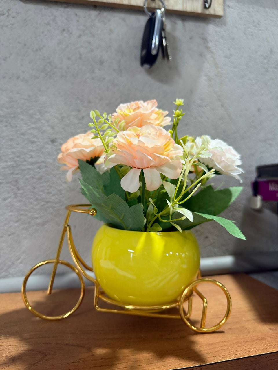 Golden Metal Bicycle Stand with Artificial Peach Roses in Glossy Yellow Ceramic Pot – Decorative Flower Arrangement for Home, Office & Gift Purpose