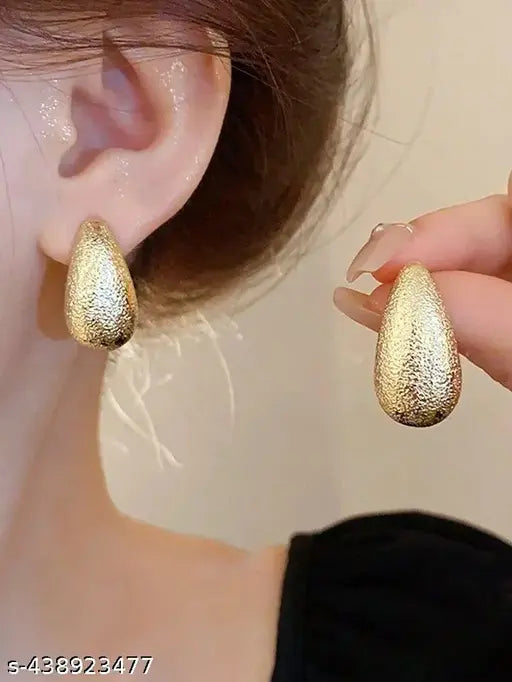 Rose Gold coloured teardrop studs.t
