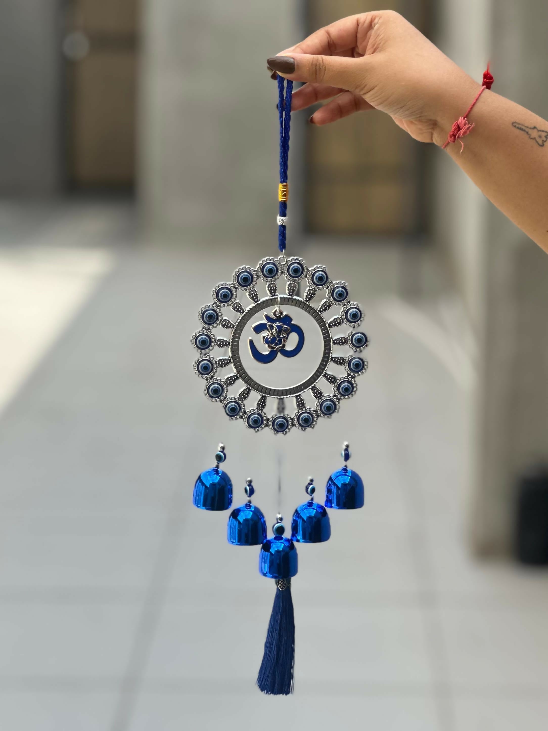 Evil Eye Wall Hanging with Om and Lord Ganesha Symbol – Decorative Blue Nazar Protection Talisman with Bells and Tassels – Vastu and Feng Shui Positive Energy Charm for Home, Office, Temple, or Car Décor