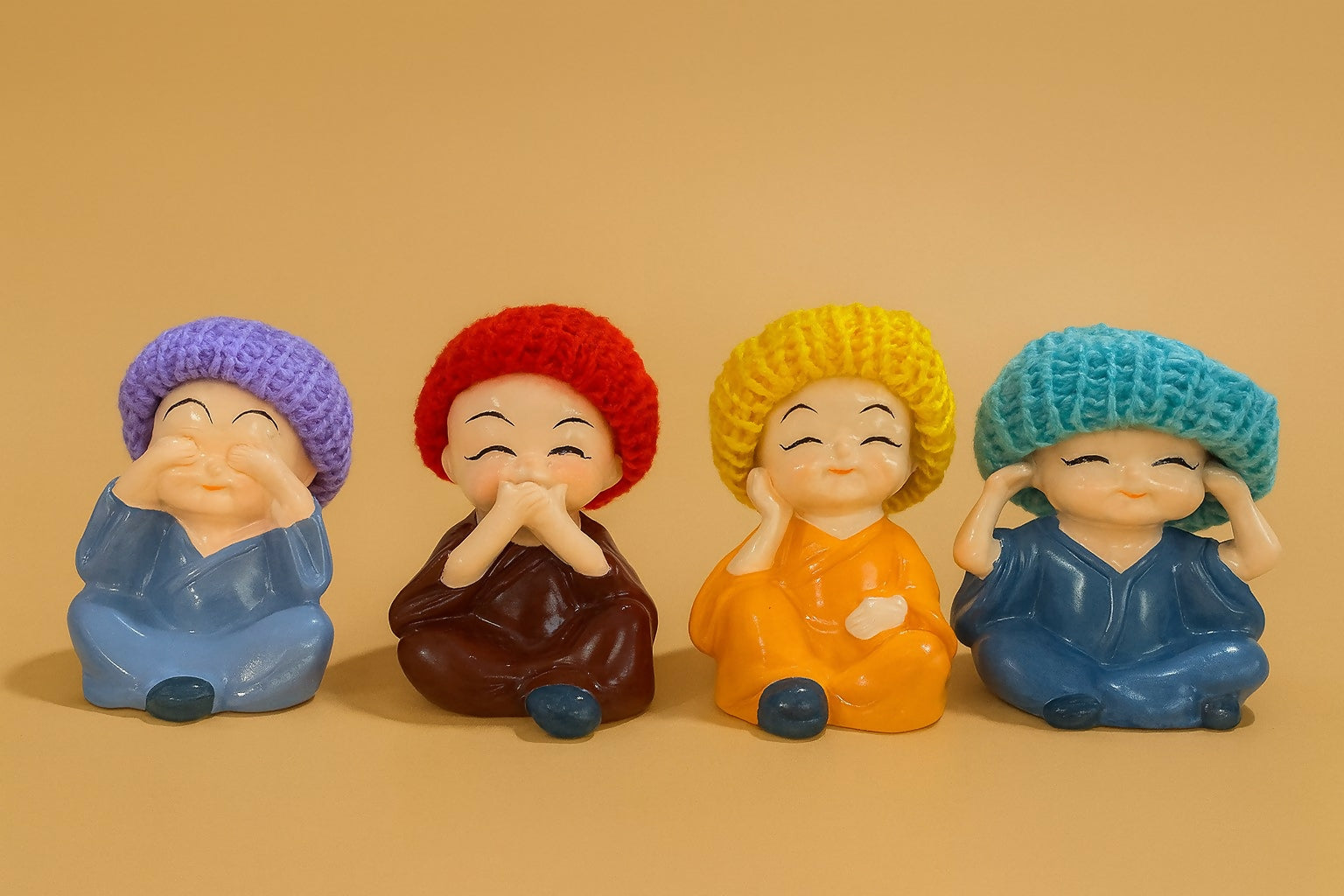 Set of 4 Cute Resin Monk Figurines with Colorful Woolen Caps – Hear No Evil, See No Evil, Speak No Evil, Think No Evil – Decorative Showpieces for Home, Office, Car Dashboard, Gifting & Feng Shui